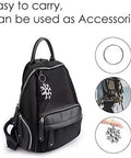 18 In 1 Snowflake Multi Tool In Stainless Steel attached to black backpack for everyday carry, showing multiple uses and portability.
