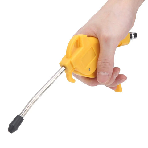 Rock Solid Pneumatic Air Blow Gun With Comfortable Grip And Interchangeable Tip For Sweeping Sawdust Off Trucks And Garage Benches held in hand.