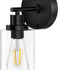 Modern Black Wall Sconce With Sleek Led Fixtures Compact Indoor Lighting Perfect For Bedroom Bathroom Or Hallway Decor, clear glass shade.