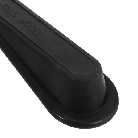Close-up of black rubber wedge from 2Pcs Black Rubber Door Stopper Wedge With Antislip Surface For Bedroom Or Office Use Easy Toolless Installation