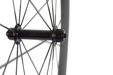 Close-up on hub and spokes of Carbon 700c Clincher Wheelset For Road Bikes, 23mm Rim Width, Toray T700 Carbon Fiber Build.