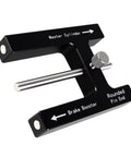 Brake booster push-rod adjustment tool, black aluminum with magnet and adjustable pins; angled view