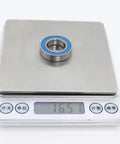 Ten Pack 6903 RS Ball Bearings 17x30x7mm ABEC-3 Shielded 2RS shown on a digital scale measuring 16.57 grams