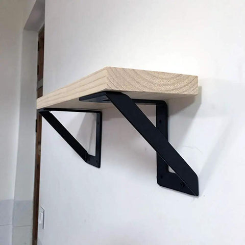 Heavy Hitter Iron Corner Brackets For Floating Shelves Built Tough Right Angle Wall Support Takes A Beating Holds Up To 176 Pounds Pair Of Two Matte Black on wall with wood shelf.