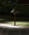 3 Watt Olde Bronze Low Voltage LED Path Light Single Fixture illuminating outdoor brick pathway in garden at night