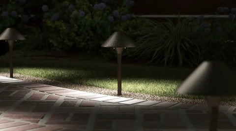 3 Watt Olde Bronze Low Voltage LED Path Light Single Fixture illuminating outdoor brick pathway in garden at night
