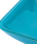 Close-up view of the Dope Premium Cyan Rectangular Glass Bathroom Vessel Sink Countertop Vanity Basin featuring a smooth finish.