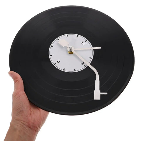 Hand holding Vinyl Record Clock Mechanism Replacement Kit with precise timekeeping and durable hands for easy DIY repair and home decor.