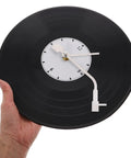 Hand holding vinyl record clock showing Vinyl Record Clock Mechanism Replacement Kit With Hands For Vinyl Clocks DIY Timekeeping Upgrade