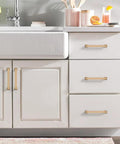 10 Pack 5 Inch Cabinet Handles In Champagne Bronze For Kitchen And Dresser Drawers installed on white cabinet doors and drawers