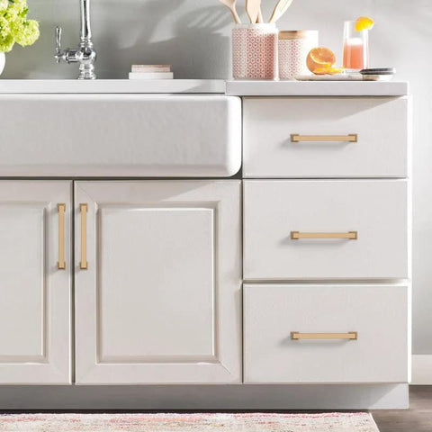 10 Pack 5 Inch Cabinet Handles In Champagne Bronze For Kitchen And Dresser Drawers installed on white cabinet doors and drawers