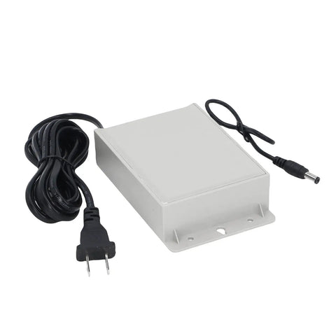No Sweat 12V UPS Battery Backup With 3600mAh Capacity And All Weather Armor, gray box with power cables, suitable for outdoor use.