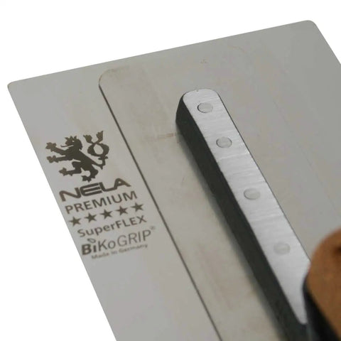 Close-up of NELA Premium Superflex Finishing Trowel 11 By 4.3 Inches With Cork Handle BiKo Grip, showcasing stainless blade.