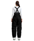 Back view of model wearing Womens Baggy Ski Bibs And Snowboard Pants Waterproof Windproof Insulated Overalls for warmth and comfort