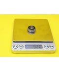 Top Rated 608 Hybrid Ceramic Ball Bearings for Skateboards And Scooters Featuring Si3N4 Balls For Smoother Spins With Low Friction And High Durability Perfect For Fast Motors And Industry Spindles At 9x22x7mm Size weighed on a digital scale.