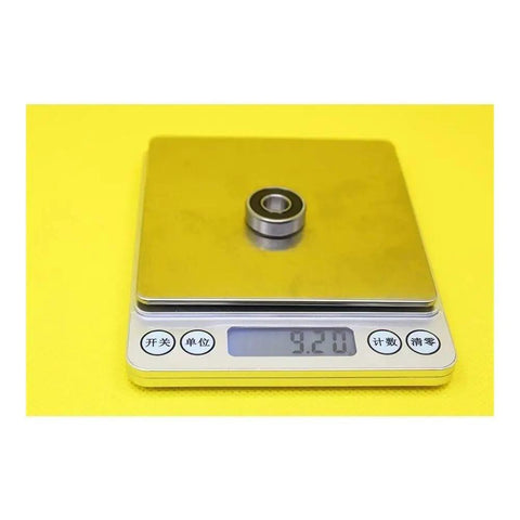 Top Rated 608 Hybrid Ceramic Ball Bearings for Skateboards And Scooters Featuring Si3N4 Balls For Smoother Spins With Low Friction And High Durability Perfect For Fast Motors And Industry Spindles At 9x22x7mm Size weighed on a digital scale.