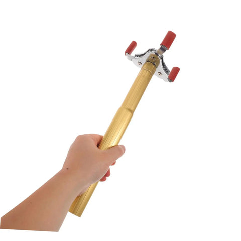 Ladder Free Smoke Sensor Removal Tool With 11 Point Eight Inch Extended Reach Stick, gold aluminum pole in hand for high ceiling use.