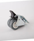 Heavy Duty Swivel Twin Casters With Brake 2 Inch Dual Rubber Wheels For No Sweat Furniture Moving Black Tires 360 Degree Spin Rock Solid Stability Smooth Operator close-up angle showing castor with black brake and dual rubber wheels.
