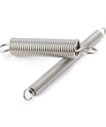 Two stainless steel springs from 100 Piece Stainless Steel Extension And Compression Spring Kit With Hooks For Home Repairs, small size