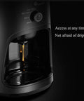 Close-up of Bean To Cup Coffee Machine With Automatic Grinder and Integrated Espresso Maker, showcasing drips from the spout.