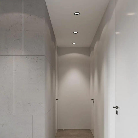 saditesdk 12Pack Led Recessed Lighting - 5W/7W Black Recessed Lights mounted in a modern hallway with sleek walls.