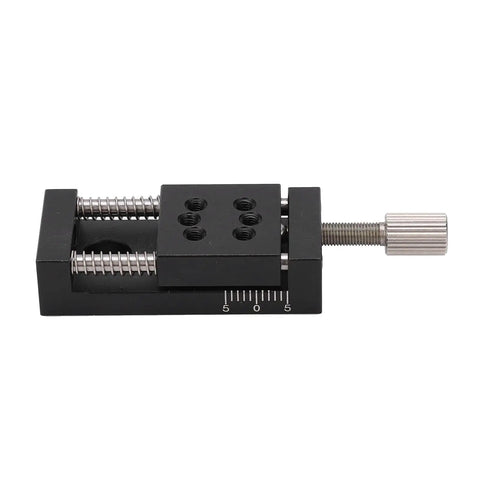 Knockout Heavy Duty Manual Linear Actuator Stage Featuring Smooth Glide Aluminum Dovetail Slide Platform And Dead Set Micro Tuning Adjustments For Real World Job Sites, black aluminum dovetail platform with micro adjusting knobs.