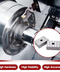 Close-up of two 1x2x3 inch hardened steel machinist gauge blocks (matched pair) with 1/2-inch hole.