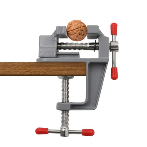 Grab N Go Portable Table Vise Clamp for Workbench, compact aluminum vise clamping a small object on desk edge