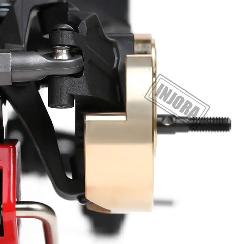 Close-up of Brass Portal Steering Knuckle For Axial SCX10 III Capra 1.9 Upgrade Set B installed on RC crawler, side view
