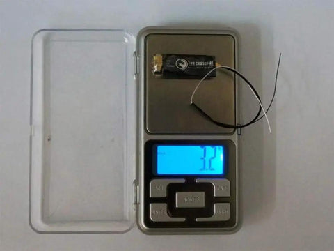 Crossfire Micro Receiver V2 Super Tiny Lightweight UHF Long Range For Mini And Micro Quads on digital scale showing 3.2g