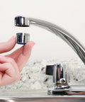Dual Thread Water Saving 1.5 GPM Aerator In Chrome Fits 15/16 Inch 27M Or 55/64 Inch 27F being installed on faucet