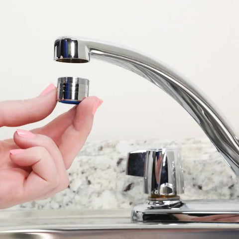Dual Thread Water Saving 1.5 GPM Aerator In Chrome Fits 15/16 Inch 27M Or 55/64 Inch 27F being installed on faucet