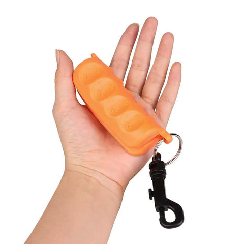 Hand holding Orange Archery Arrow Puller Gripper With Belt Clip Two Pack Grab And Go Soft Molded Handle Anti Skid Grip Easy Arrow Removal