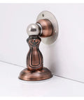 Stylish Brushed Red Bronze Door Stopper With Hidden Catch To Save Skirting Boards and Protect Walls From Dings Using Strong Magnetic Hold For A Slam Free Home Without Needing Nails Or Drills Anywhere. Side view of magnetic door stopper.