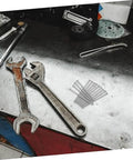 Stainless Steel Countersunk Flat Head Self Tapping Screws for Furniture Assembly on workbench, next to wrenches and tools.
