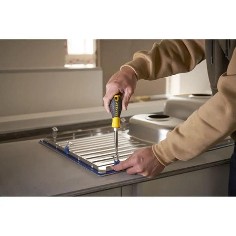Person using 6 Way Screwdriver Set With Space Saving Design And Chrome Plated Bar For Corrosion Resistance Ergonomic Handle For Comfort