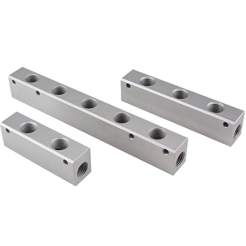Still Awake 2‑Way pneumatic manifold block, aluminum alloy, four blocks with G1/2 supply and G1/4 outputs (angled view).