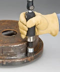 Zero Point Seven Horsepower Straight Line Die Grinder With Reinforced Steel Housing in use on a metal workpiece for surface finishing.