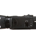 Side view of HF G70 4K Camcorder with 20x optical zoom, dual SD slots, and HDMI output, showcasing professional UHD video features.
