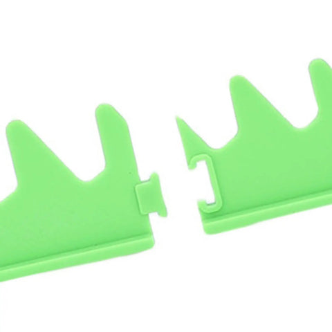 Close-up of green plastic connector pieces for Magnetic Wrench Rail Set And Holder Rack For 20 Tools With Durable Plastic Storage.