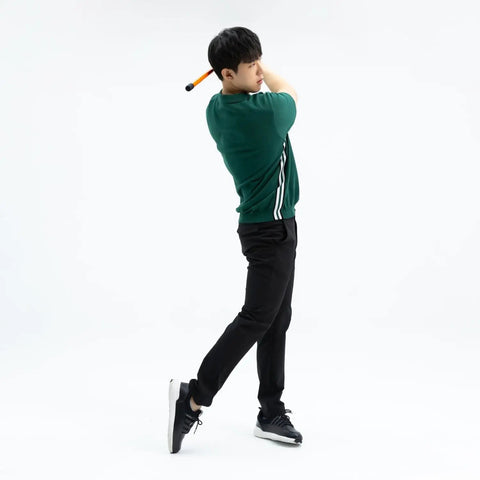 Man using Golf Swing Trainer Pro Indoor Practice Aid With MAX SPEED Stick and Speed Pointer at home