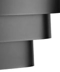 Detail of black tri-band louvered shade from One Light Louvered Wall Sconce Light Fixture In Black Finish, Modern Design For Entryway Hallway Foyer Bedroom And Living Room, Tri Band Louvered Shade That Glows From The Top, Seven Inch Tall showing overlapping bands.