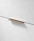 Lincoln Collection 5 1/16 Inch Center To Center Brushed Champagne Bronze Modern Cabinet And Drawer Edge Pull Handle installed on drawer