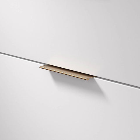 Lincoln Collection 5 1/16 Inch Center To Center Brushed Champagne Bronze Modern Cabinet And Drawer Edge Pull Handle installed on drawer
