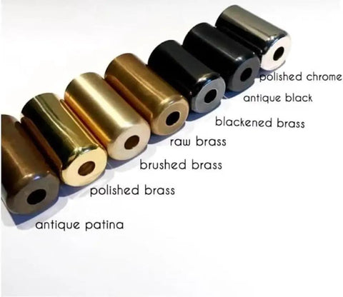 Various metal finishes including polished chrome, antique black, and brushed brass samples for wall sconce fittings.