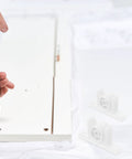Installing 10 Pack White Cabinet Ball Catch Latch Set For Cupboard Doors with screwdriver, components shown