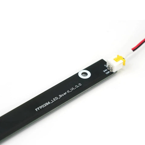 Close-up of Lit LED Light Strip For Adventurer 5M Pro 3D Printer, showing connector and markings, enhancing work area visibility.