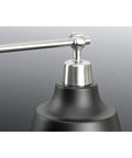 Close-up of nickel finish detail on Bramlett Bath And Vanity Light, showcasing vintage industrial style.
