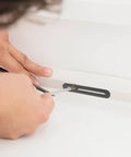 Person installing adjustable stainless steel flat joining plates with slot holes for wood furniture repair