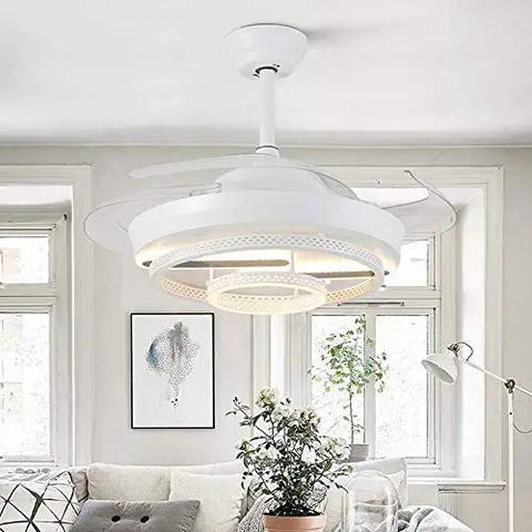 Modern 42 Inch Retractable LED Ceiling Fan With Wireless Remote Control, mounted in a bright room with large windows.